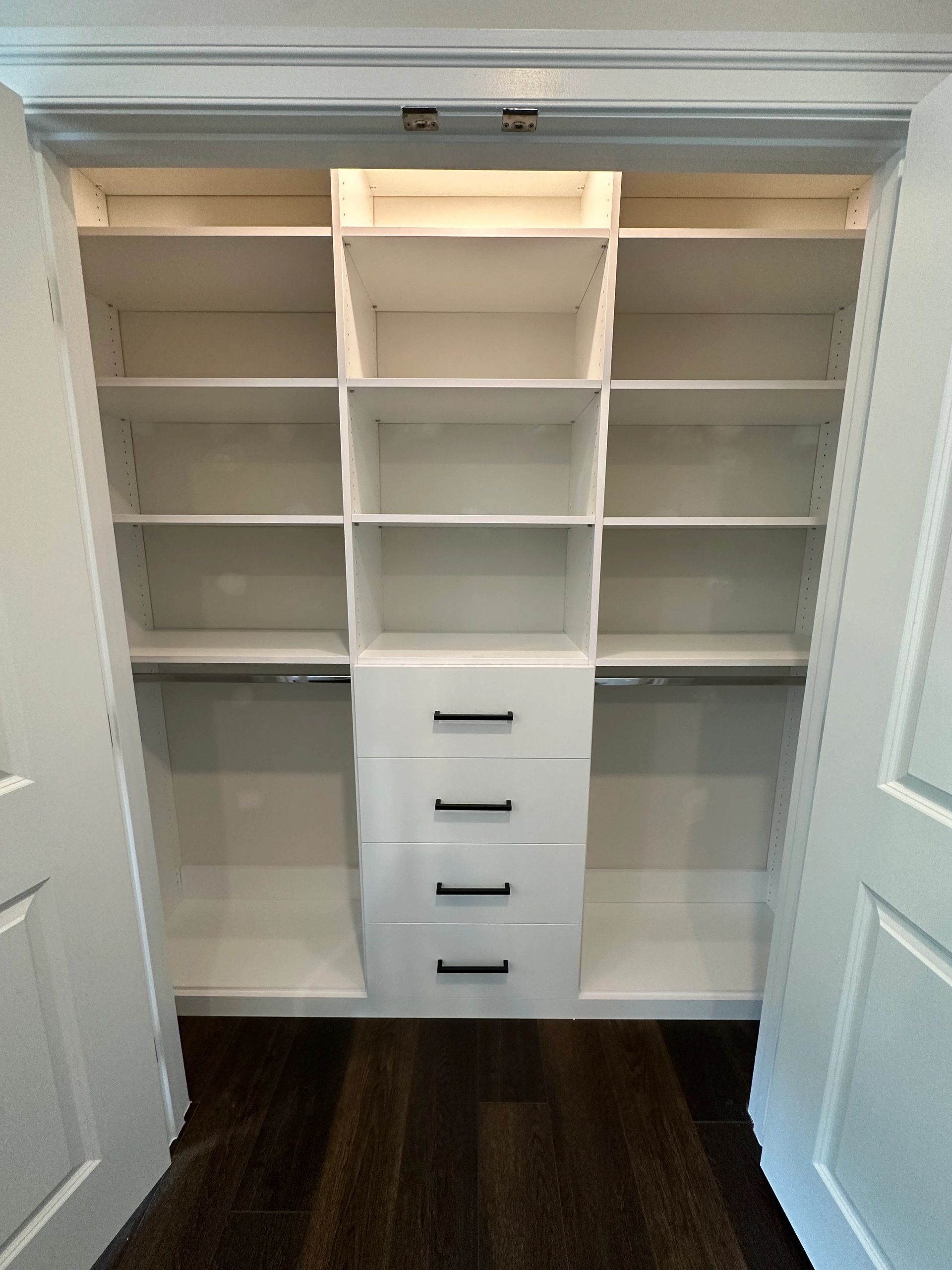 White reach-in closet adjustable shelving Fantasy Closets